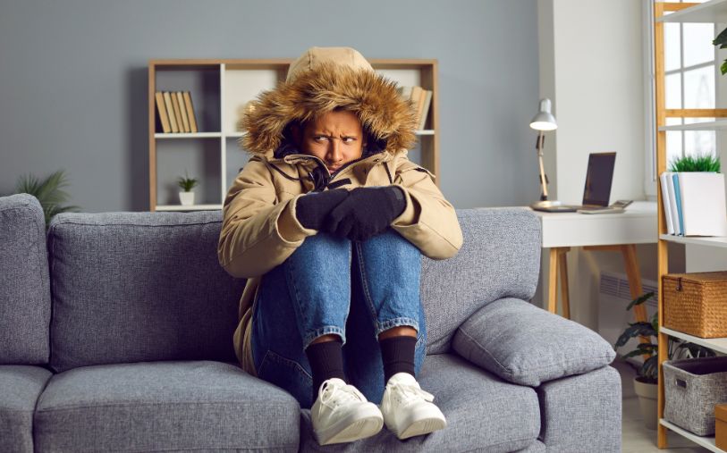 Image of man cold in house.