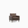 Brown armchair in a dark room