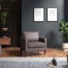 Grey armchair in a dark room
