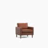 Tan armchair in a dark room