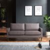 Grey three seater sofa in a dark room